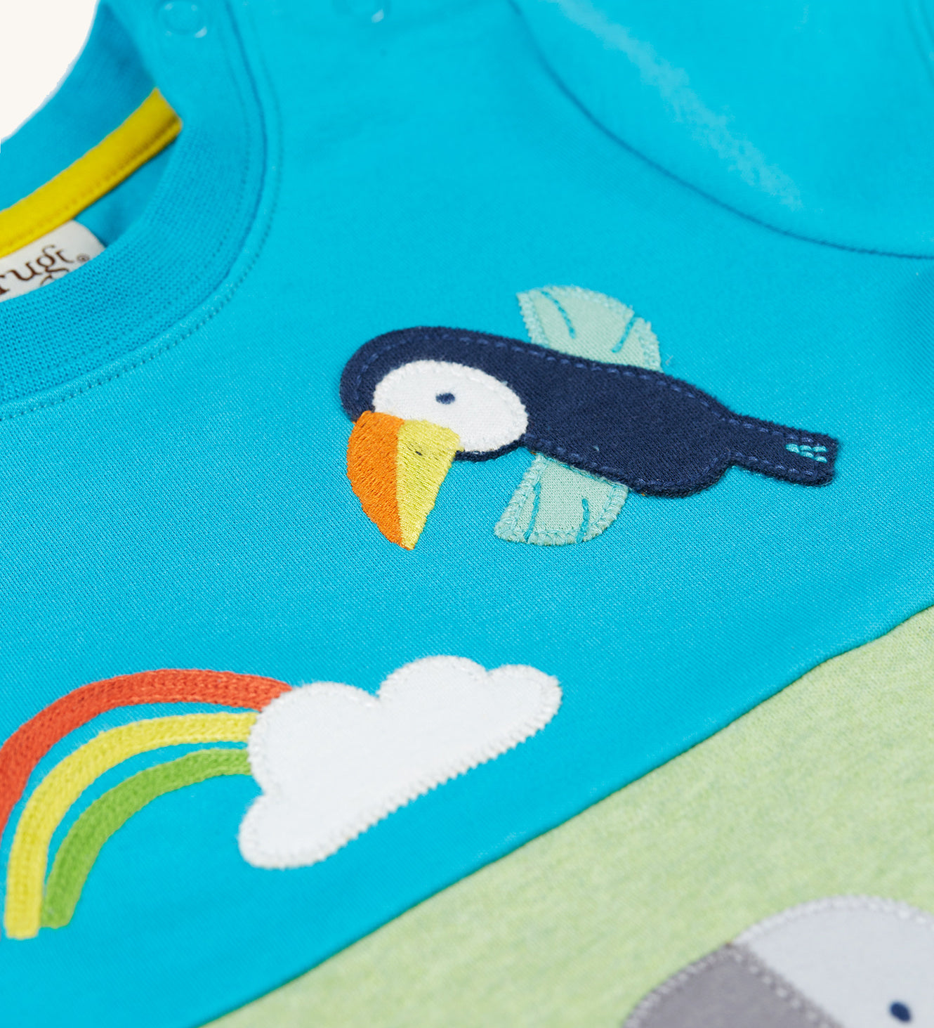  elephant and toucan character applique on the front