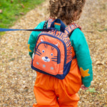  this Little Adventurers Backpack from Frugi comes in an orange and navy blue Tiger print. This bag has a interactive tiger ears