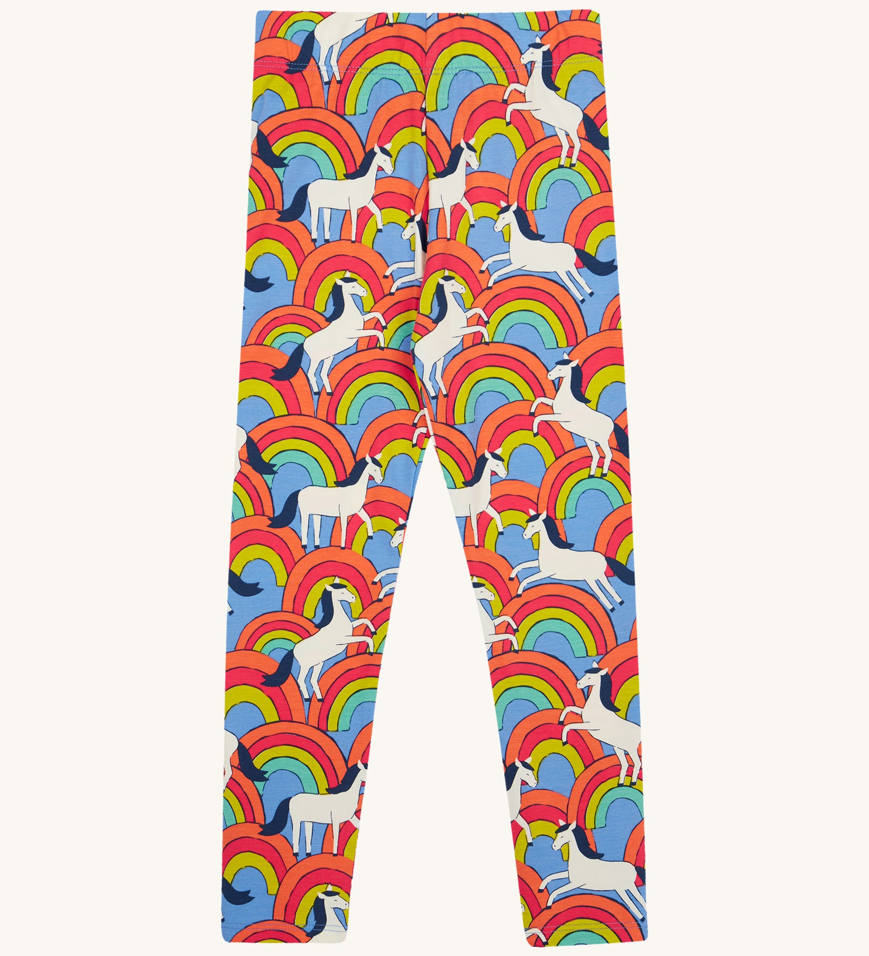 Frugi kids over the rainbow leggings - GOTS organic cotton Frugi kids leggings   in light blue with white horses on top of bright multicoloured rainbows 