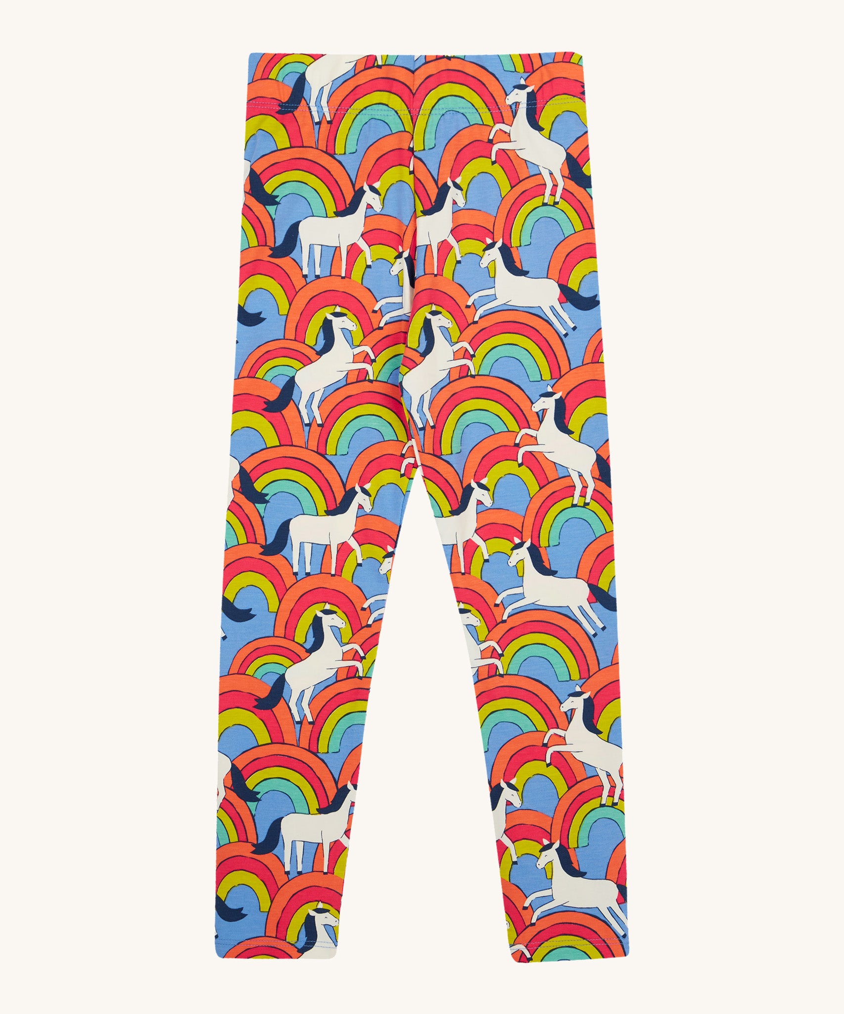 Frugi kids over the rainbow leggings - GOTS organic cotton Frugi kids leggings   in light blue with white horses on top of bright multicoloured rainbows 