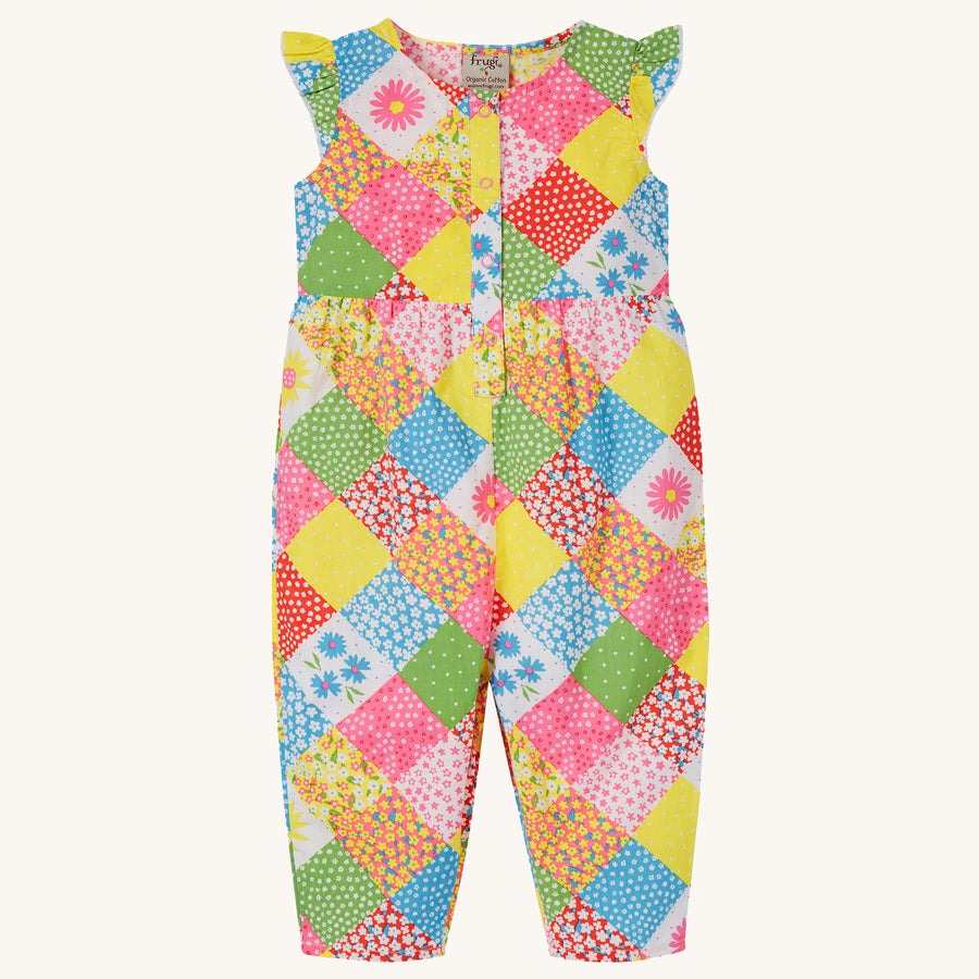 Frugi Children's Organic Cotton Etta Play-suit - Patchwork. A bright and colourful patchwork play-suit with beautiful flower print in patchwork squares, on a cream background.