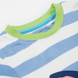 A close up of the Frugi kids Porth collie dog pyjama set showing the green neck trim on a blue and white striped organic cotton fabric