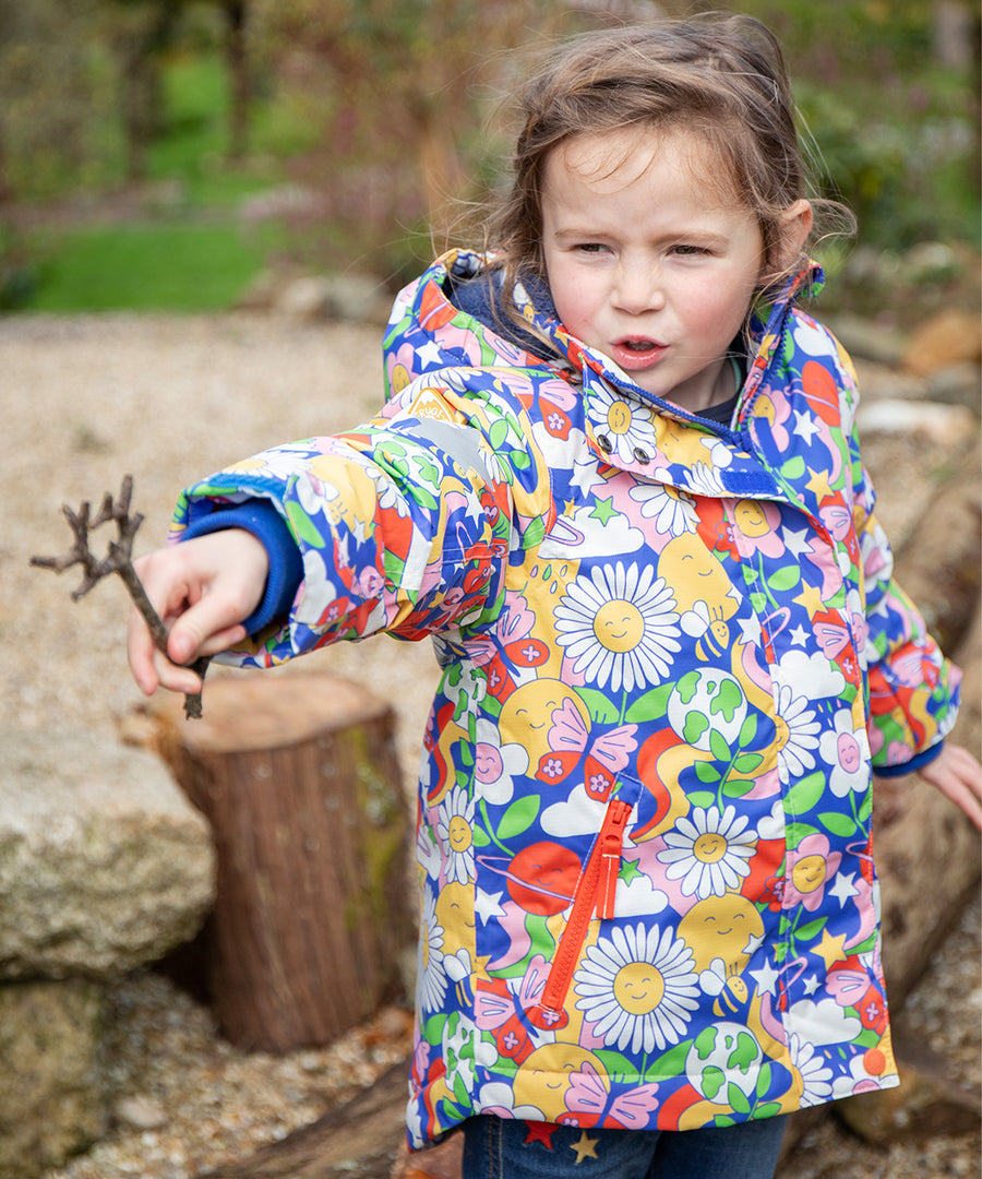 A child wearing the Frugi Children's Snow & Ski Coat - Retro Happy