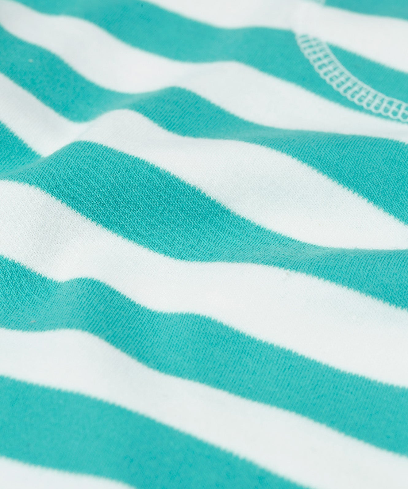 Close up of the Frugi kids sunny sea moss short - showing the blue and white stripe print on organic cotton fabric