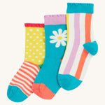 Frugi kids Freya frilled let's create 3 pack socks - GOTS organic cotton kids socks with light frills. Features a striped socks with a light blue cuff, a light blue sock and white daisy design and a spotted/striped sock.