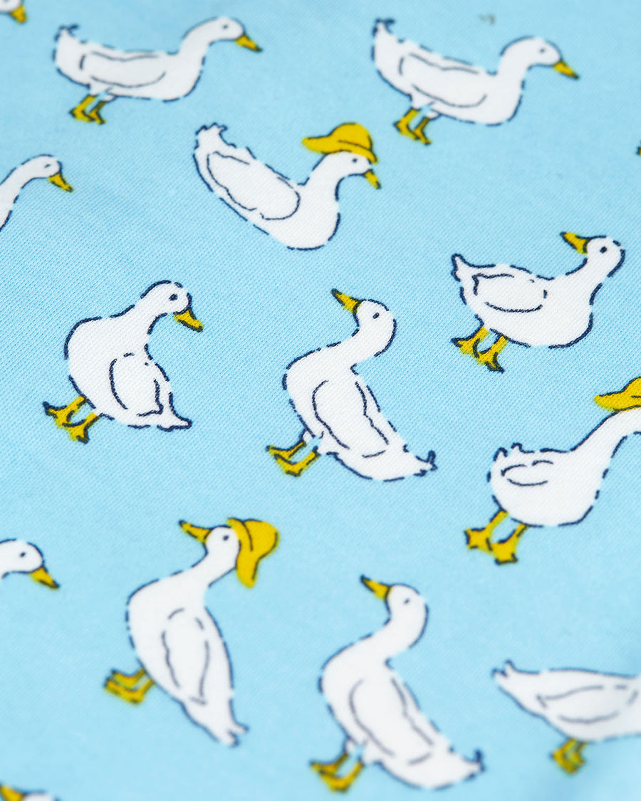  of a light blue duck print all in one on a cream background