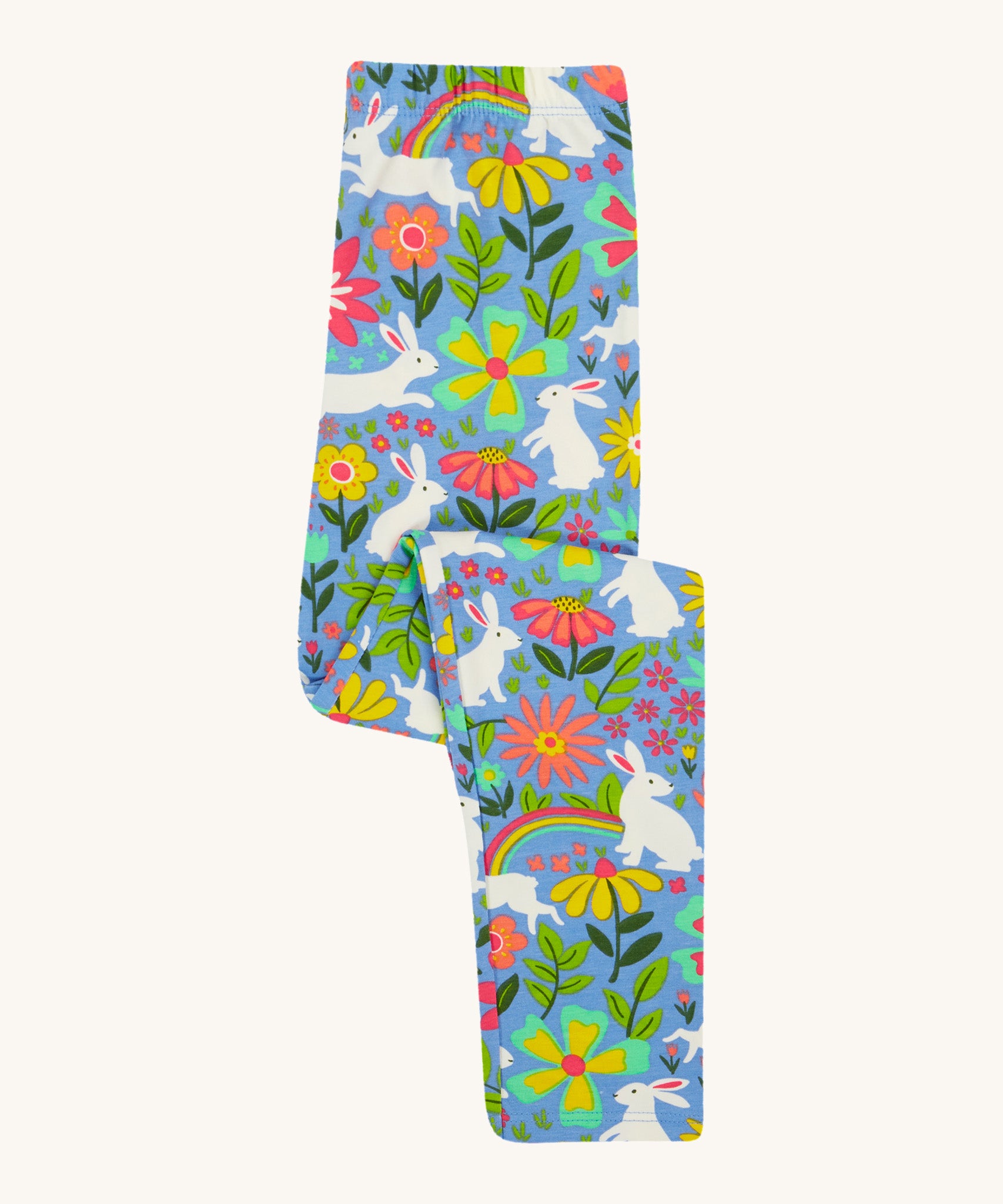 Frugi kids bunny bounce libby leggings - GOTS organic cotton kids light purple leggings folded. Features a flower and rainbow design with white bunny rabbits. 