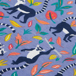 Close up of the Frugi kids summer holiday dress lemur laughs. Showing the lemurs on the bottom half surrounded by different coloured leaves  on purple organic cotton fabric