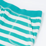 Close up of the Frugi kids sunny sea moss short - showing the front pocket and blue waist band on blue and white stripe organic cotton fabric