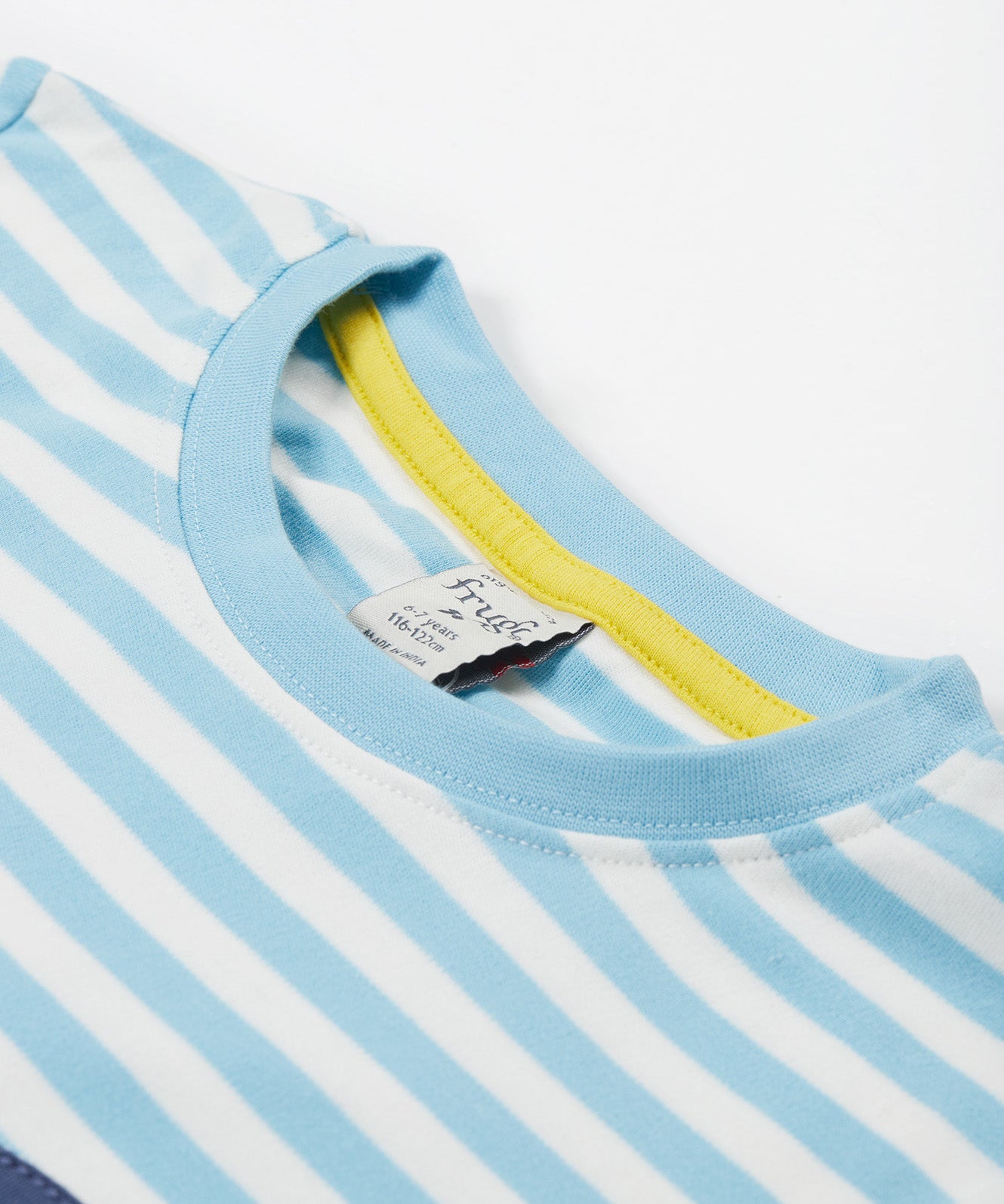 A close up of the Frugi kids bluebird tennis t-shirt. Showing the light blue neck trim with a yellow trim on the inside on white striped organic cotton fabric