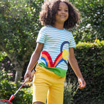 A child wearing the Frugi Tennis Penryn Panel T-Shirt with the bumblebee yellow coloured Samson shorts.