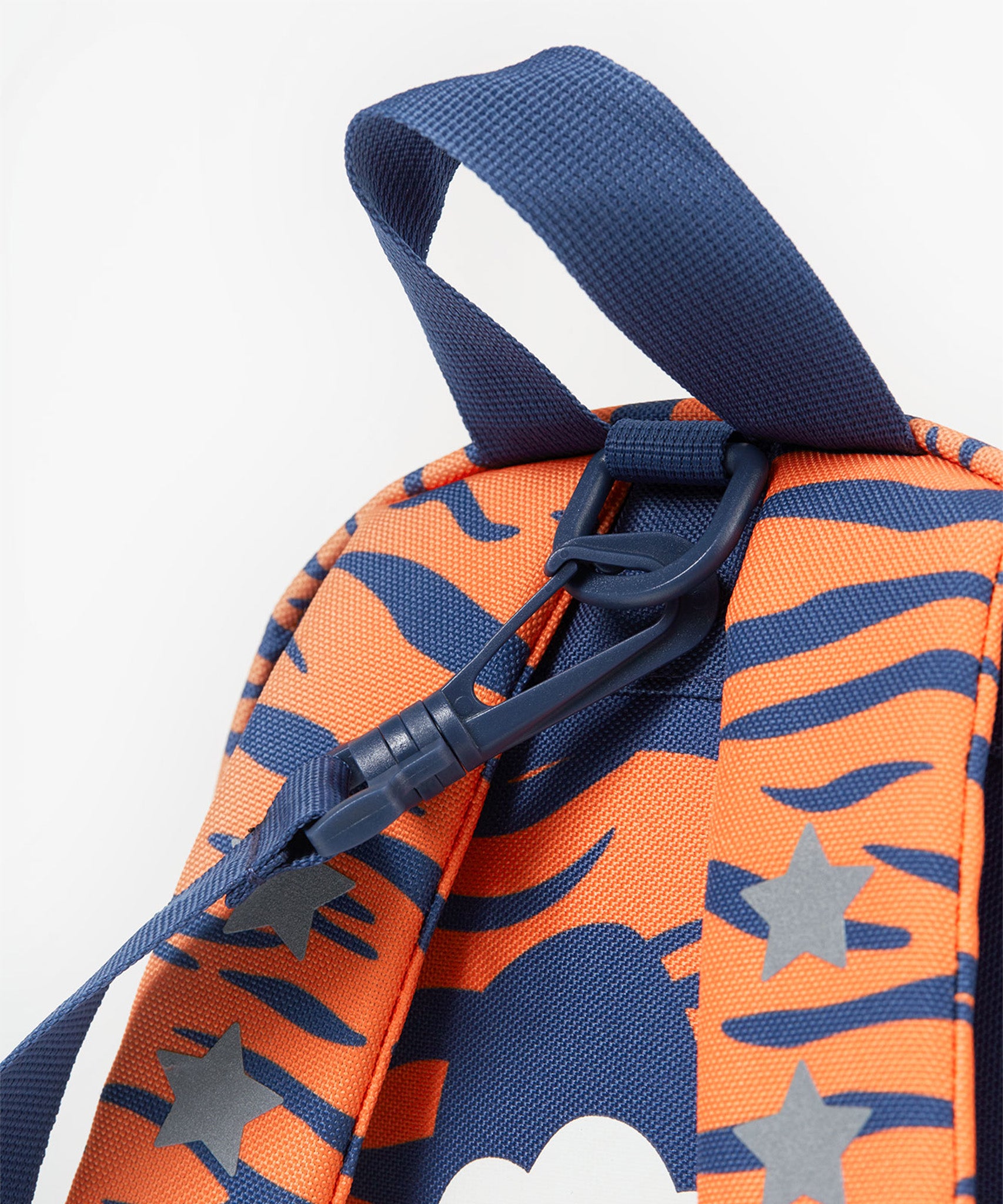 A closer look at the tiger face and interactive tiger ears on the The Little Adventurers Backpack - Salamander/Tiger