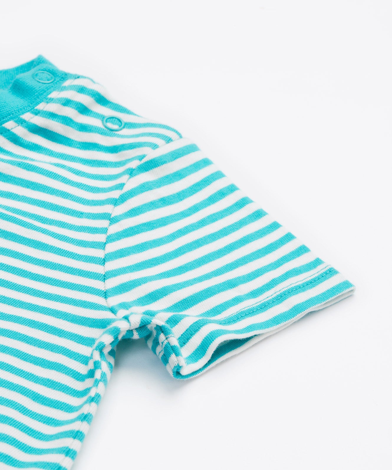 A close up of the Frugi kids moss stripe wildlife t-shirt. Showing the shoulder popper fasteners for easy fitting, light blue neck trim and short sleeves on blue and white stripe organic cotton fabric