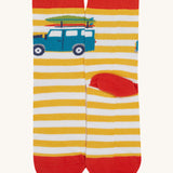 A close up of the Frugi campveran yellow and white sock a soft GOTS cotton sock features a red sole and toes panel