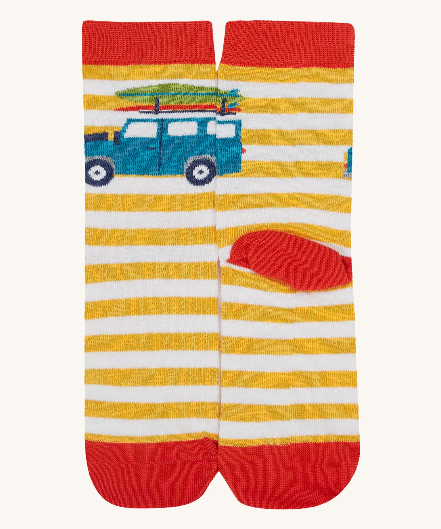 A close up of the Frugi campveran yellow and white sock a soft GOTS cotton sock features a red sole and toes panel