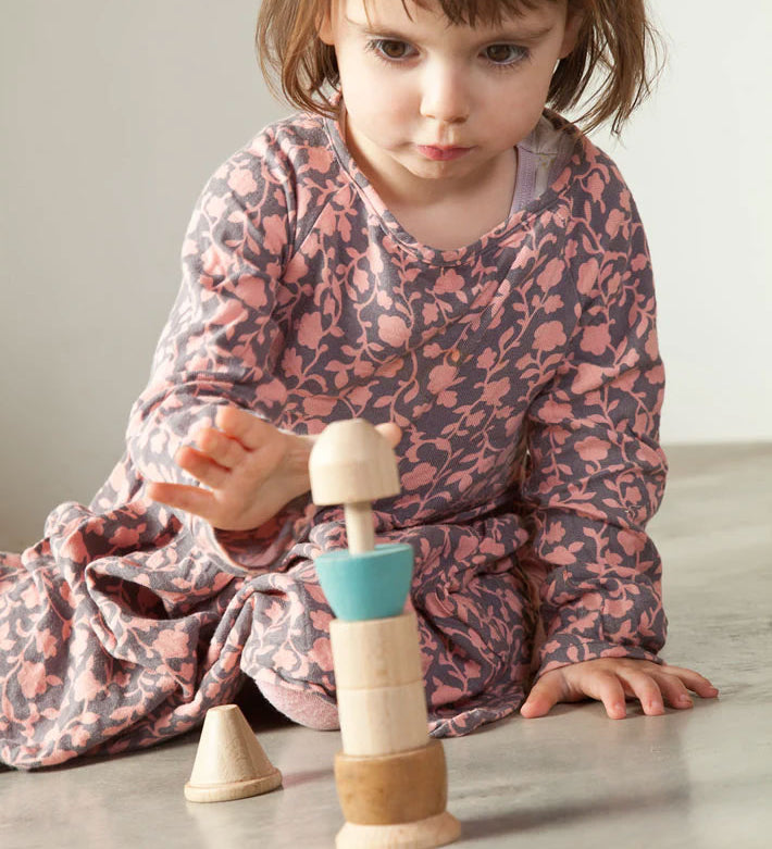 A child playing with the Grapat Stacking Figure.