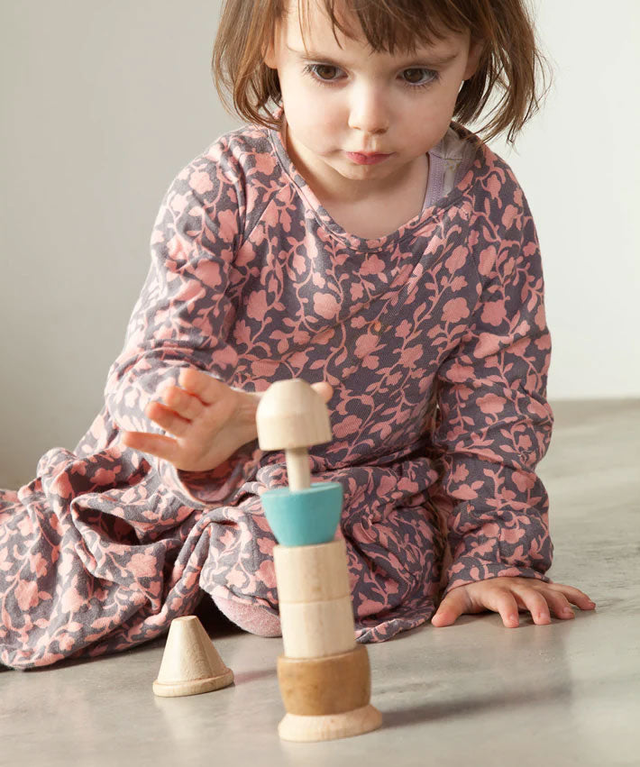 A child playing with the Grapat Stacking Figure.