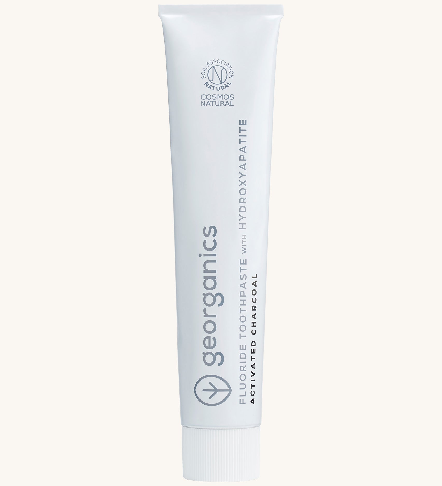 Front view of the Georganics activated charcoal hydroxyapatite toothpaste. A white tube with grey and black branding text. 