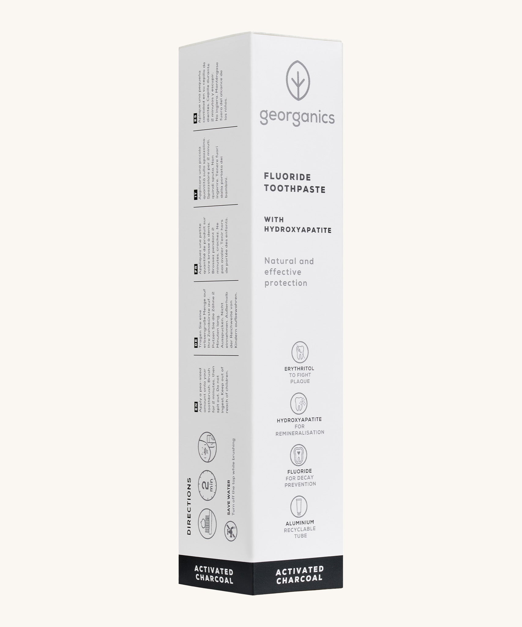 Side view of the Georganics activated charcoal hydroxyapatite toothpaste cardboard packaging, white with grey and black  text showing the instructions and features.