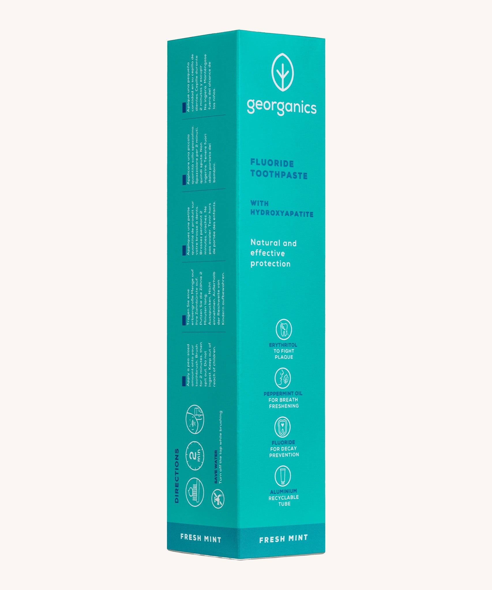 Side view of the Georganics fresh mint hydroxyapatite toothpaste cardboard packaging, a light green box with white and blue text showing the instructions and features.