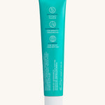 Back view of the Georganics fresh mint hydroxyapatite toothpaste tube. Showing the ingredients and features in white text.