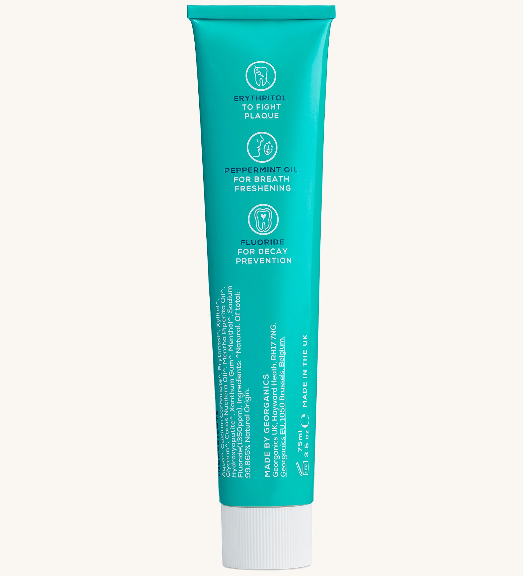 Back view of the Georganics fresh mint hydroxyapatite toothpaste tube. Showing the ingredients and features in white text.