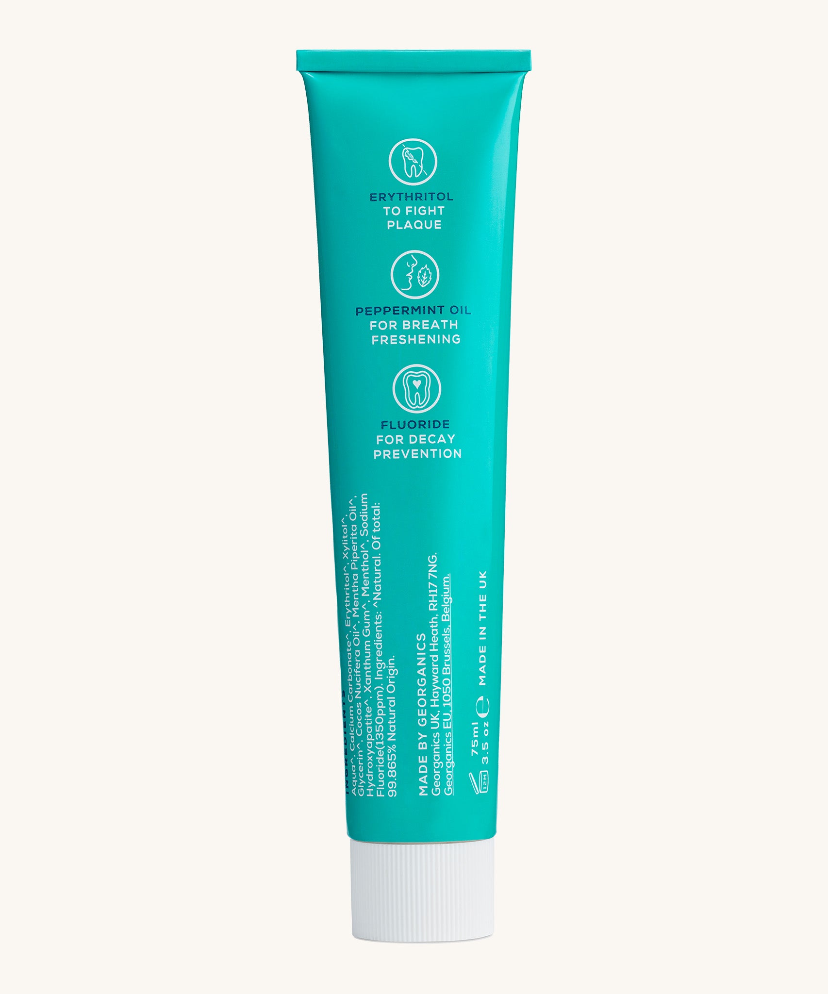 Back view of the Georganics fresh mint hydroxyapatite toothpaste tube. Showing the ingredients and features in white text.