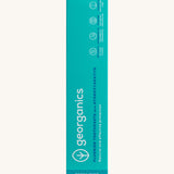 Front view of the Georganics activated charcoal hydroxyapatite toothpaste cardboard packaging, light green box with white and blue branding text. 