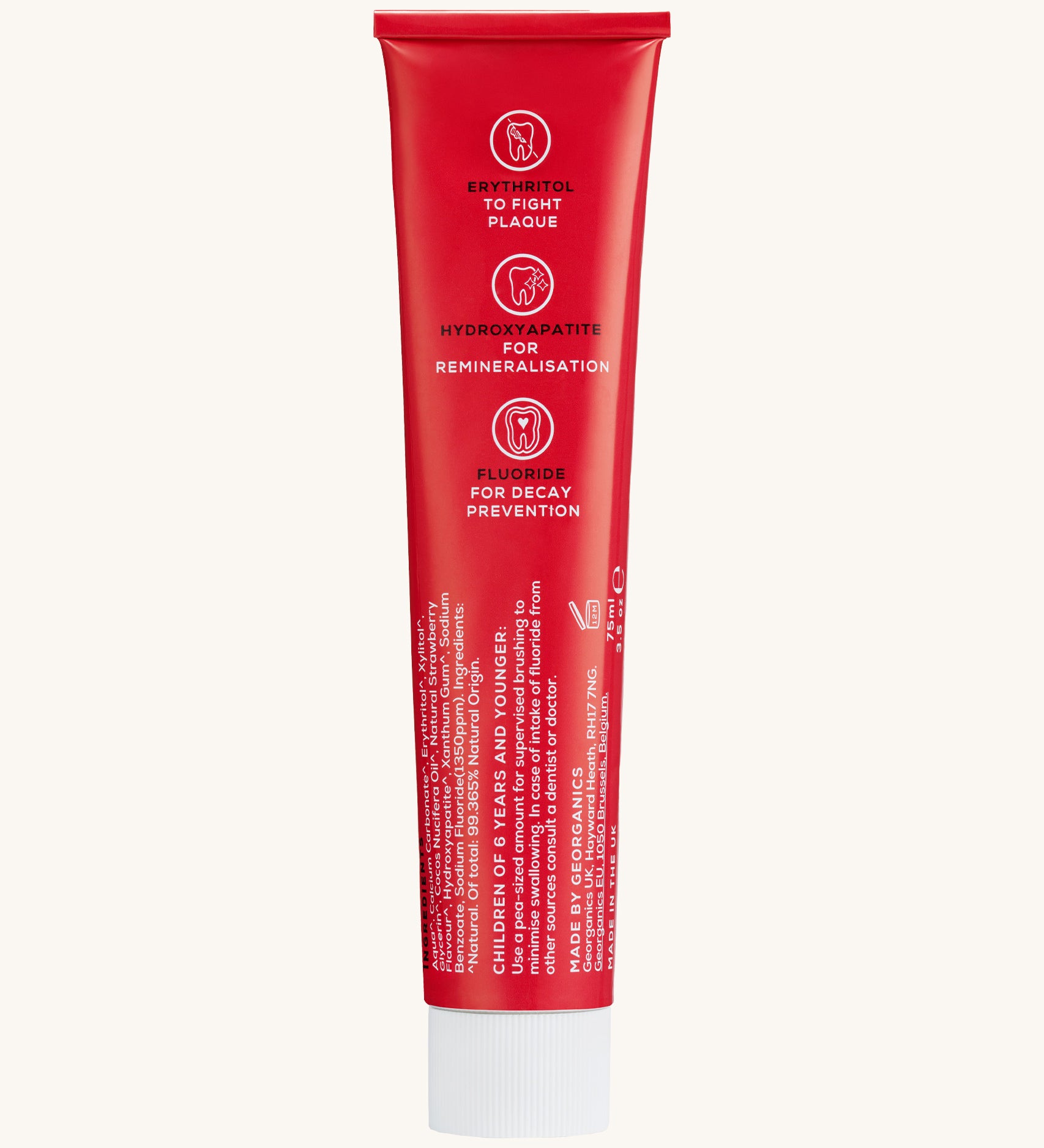 Back view of the Georganics strawberry hydroxyapatite toothpaste tube. Showing the ingredients and features in white text