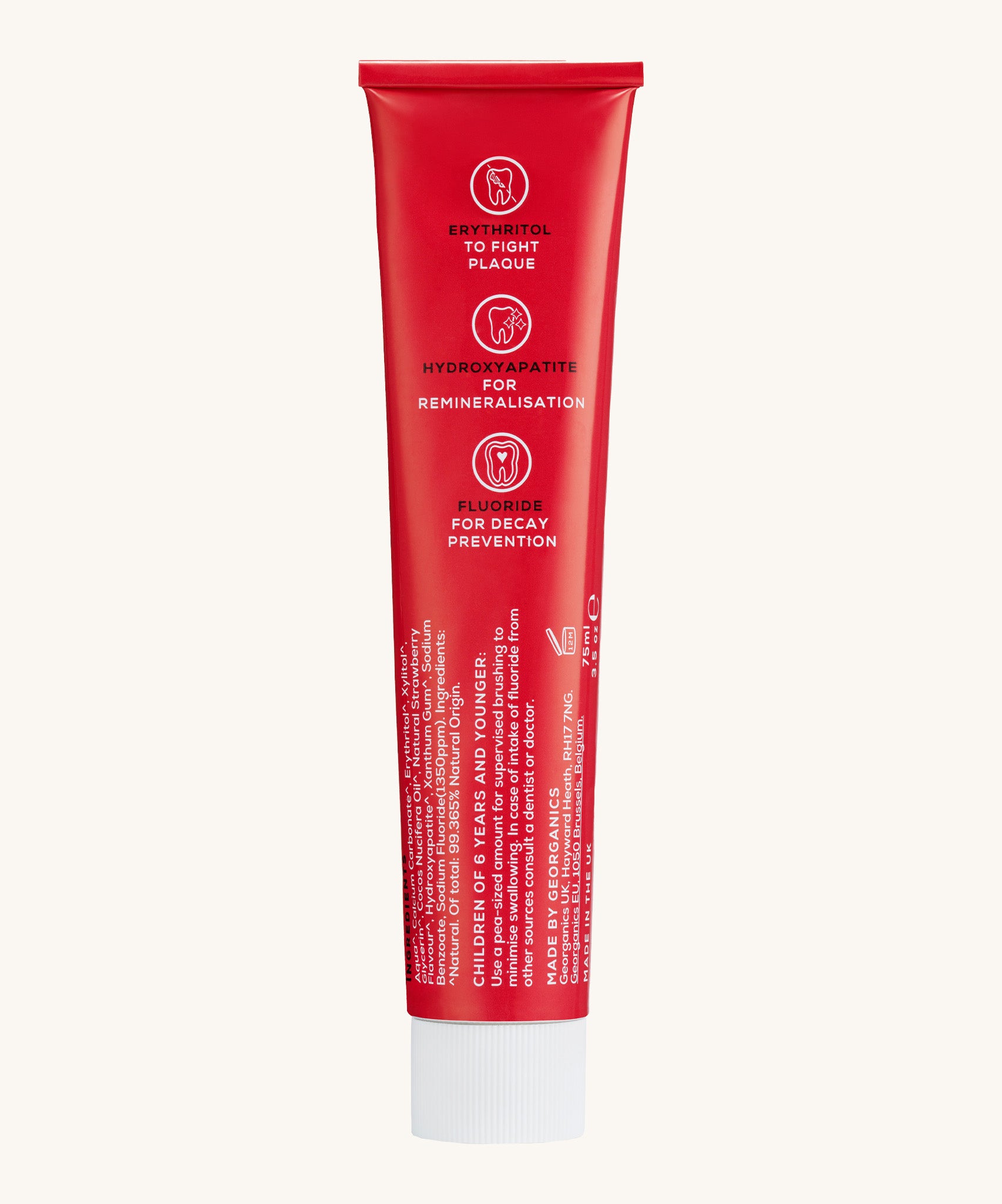 Back view of the Georganics strawberry hydroxyapatite toothpaste tube. Showing the ingredients and features in white text