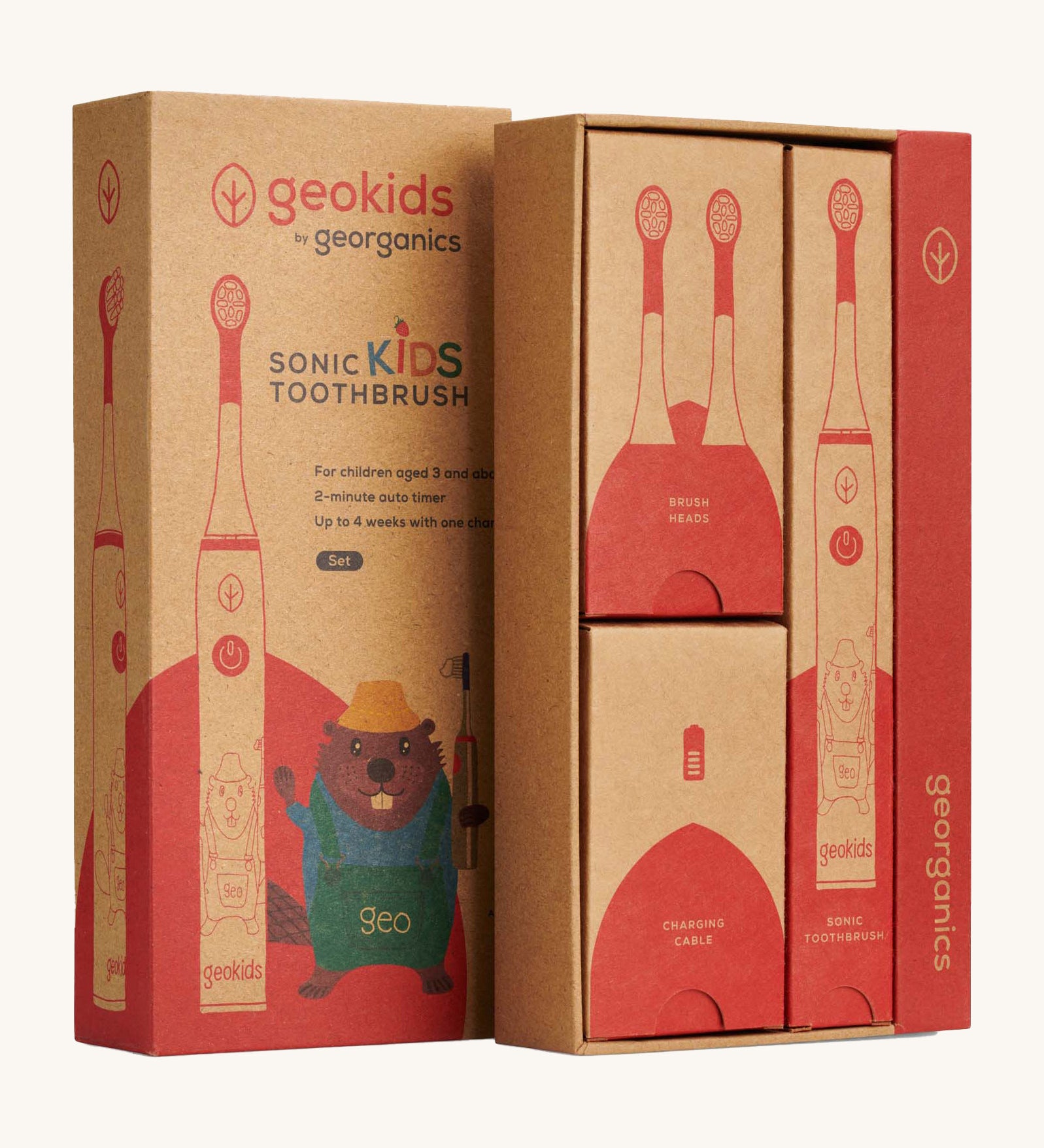 Close up view of the Georganics sonic kids toothbrush set cardboard packaging. Features different compartments for each piece. Features a playful beaver design on the front lid