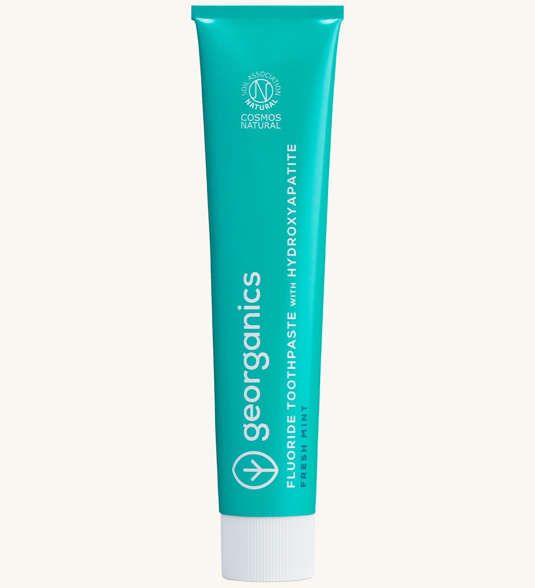 Front view of the Georganics fresh mint hydroxyapatite toothpaste. A light green tube with white and blue branding text. 