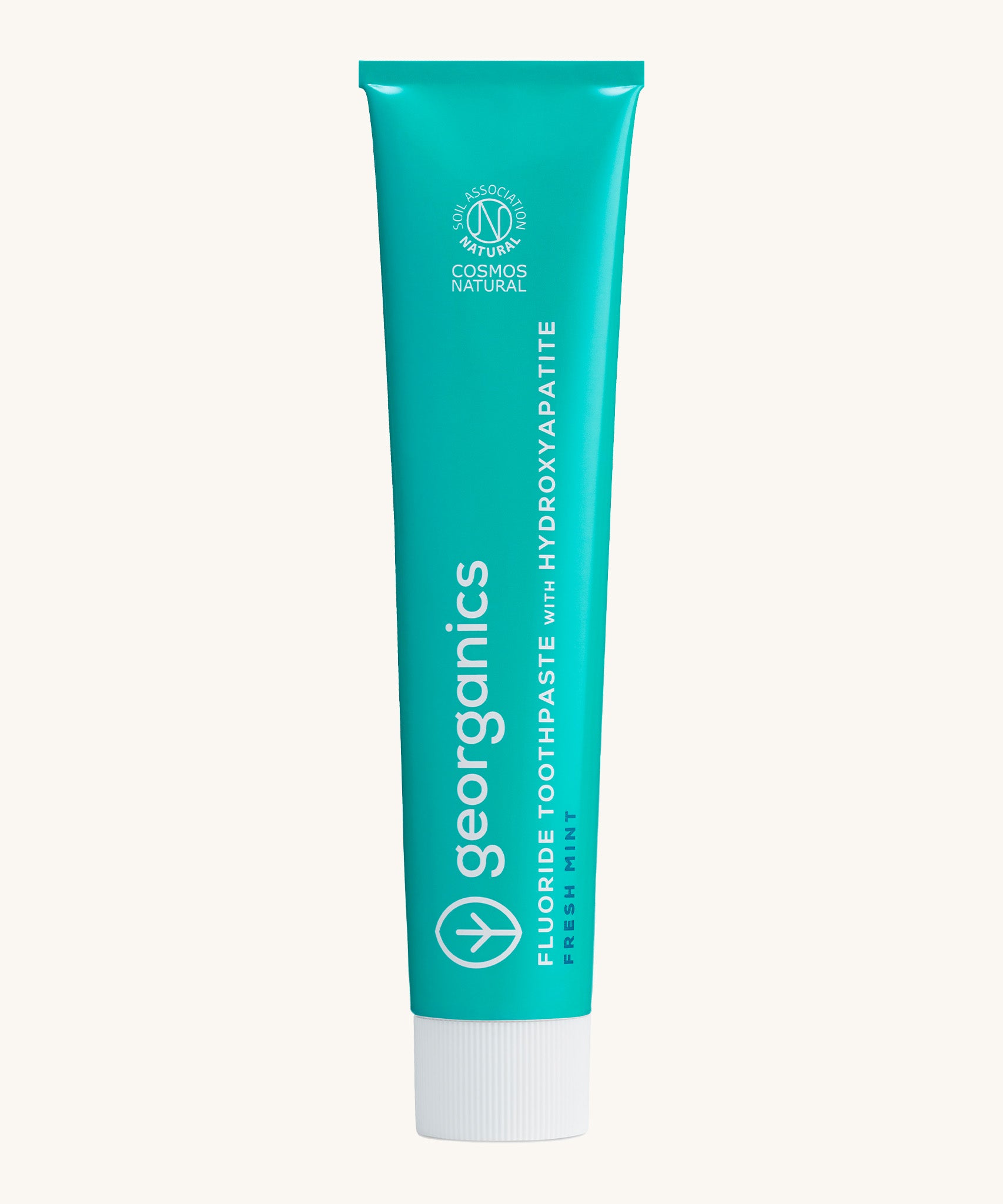 Front view of the Georganics fresh mint hydroxyapatite toothpaste. A light green tube with white and blue branding text. 