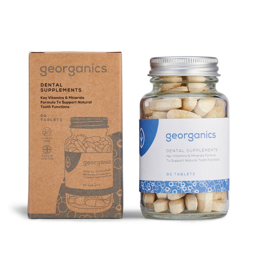 Jar of Georganics natural dental vitamins in a glass jar next to their cardboard box packaging on a white background