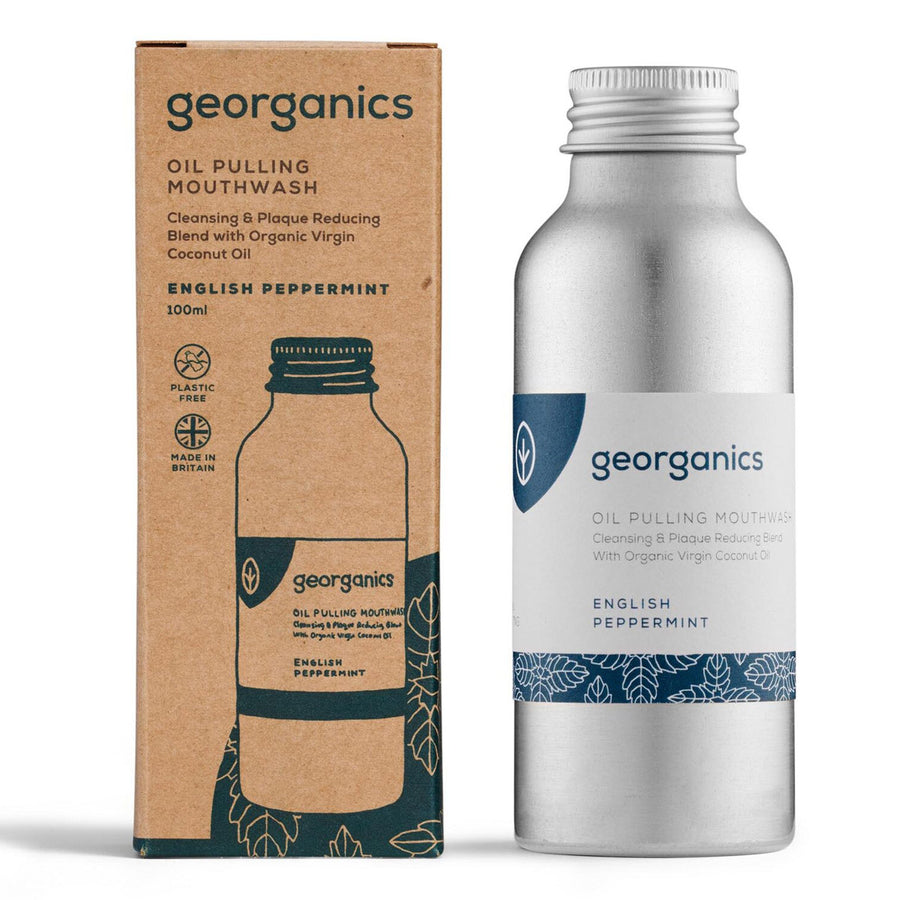 Bottle of Georganics Vegan-friendly peppermint mouthwash on a white background next to its cardboard packaging