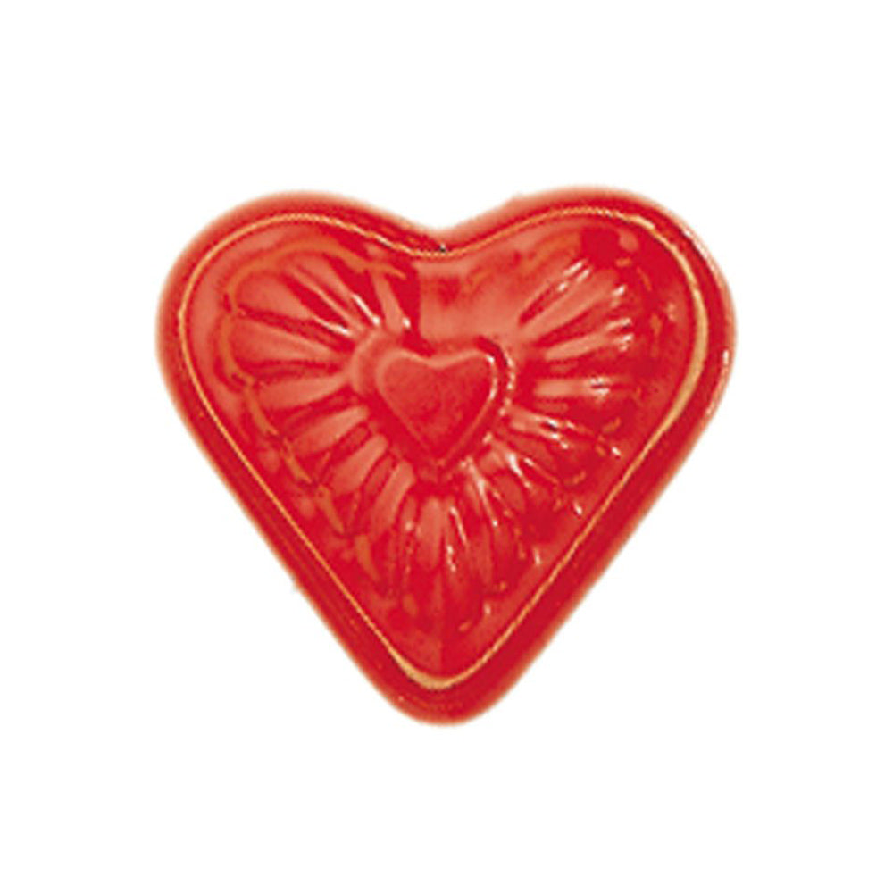 Gluckskafer red metal heart shaped sand mould on a white background