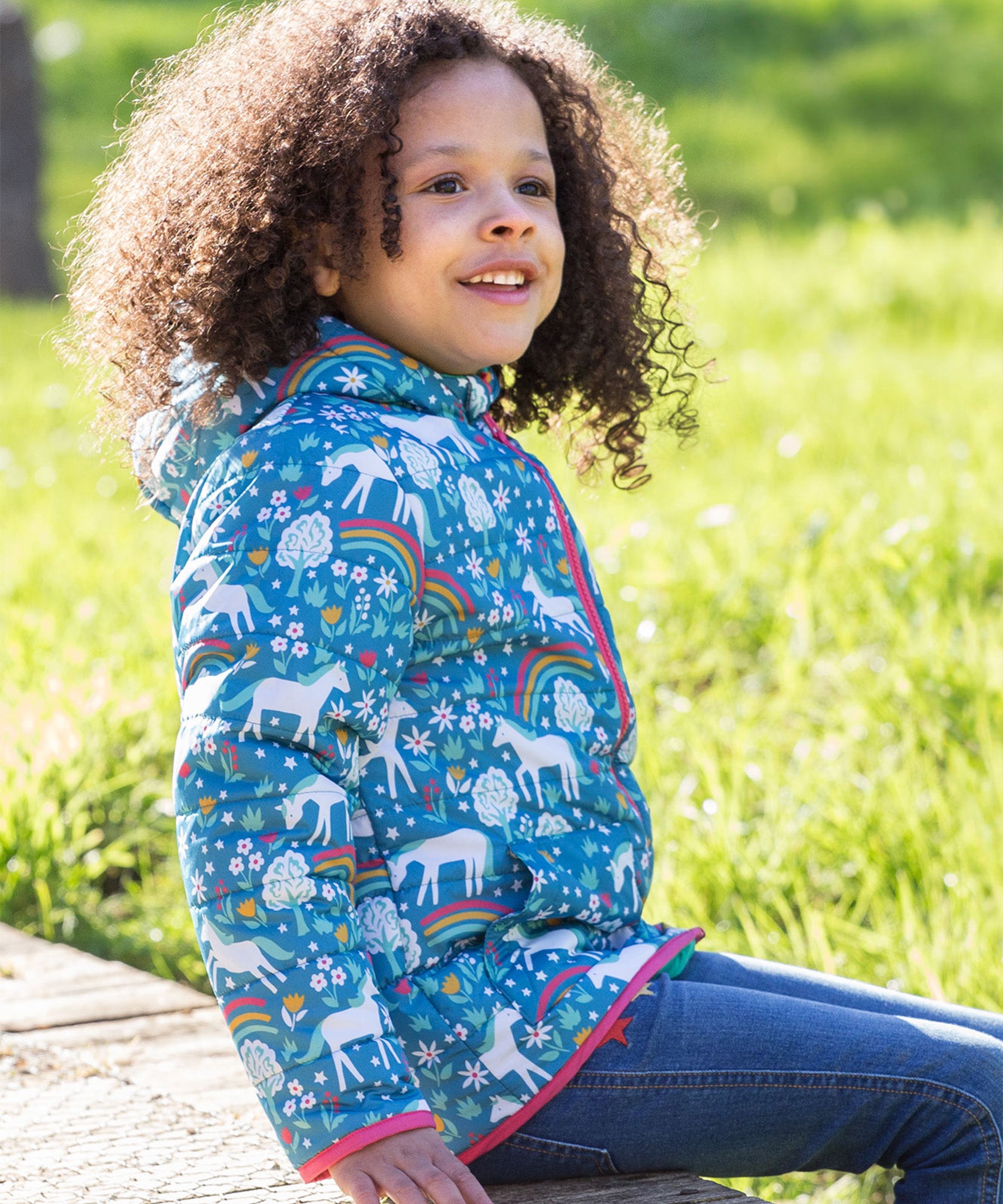 The turquoise side of the Frugi Reversible Toasty Trail Jacket - Wild Horses