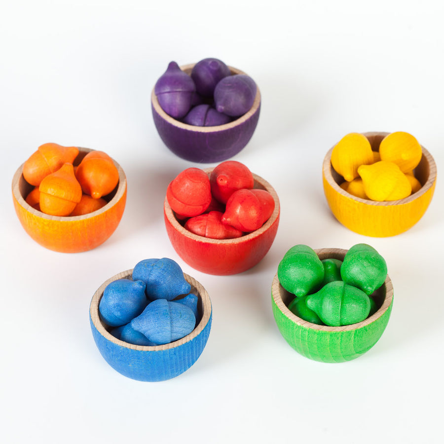 Grapat Wooden Toy Bowls & Acorns Set - 6 rainbow coloured small wooden bowls each with 6 coloured acorns. White background.