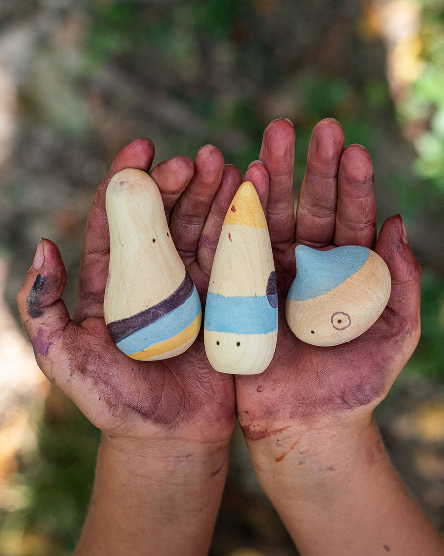 Close up of childs hands covered in paint