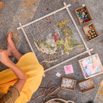 Pieces of the Grapat wooden frame set laid out on a white background