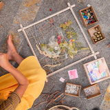 Pieces of the Grapat wooden frame set laid out on a white background