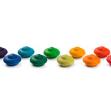 Pieces from the Grapat Waldorf Rainbow Flowers toy set lined up on a white background