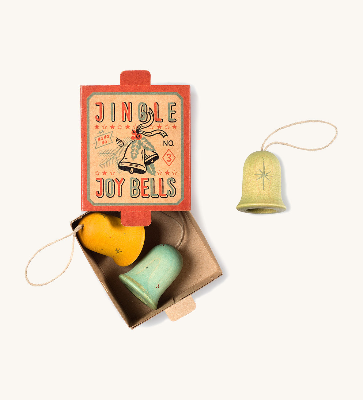 A opened red and light blue cardboard box for the Grapat wooden jingle joy bells with the light green,blue and yellow jingle joy bells inside on a cream background.