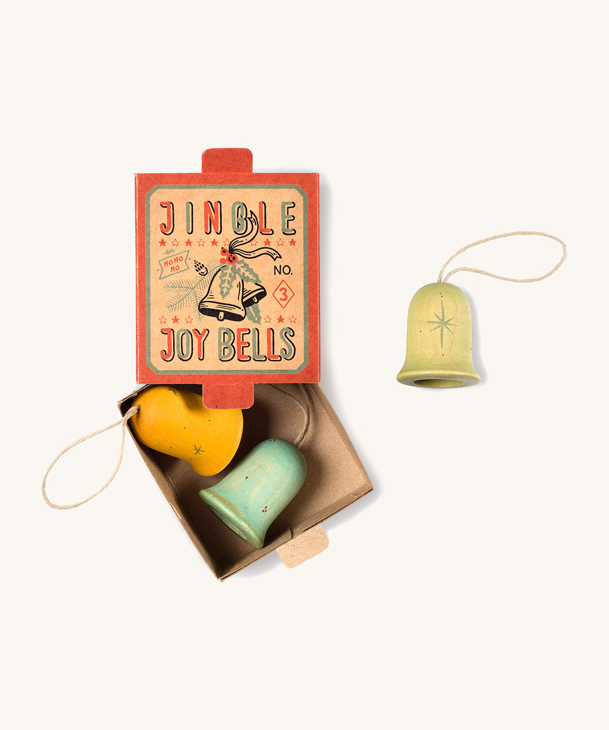 A opened red and light blue cardboard box for the Grapat wooden jingle joy bells with the light green,blue and yellow jingle joy bells inside on a cream background.