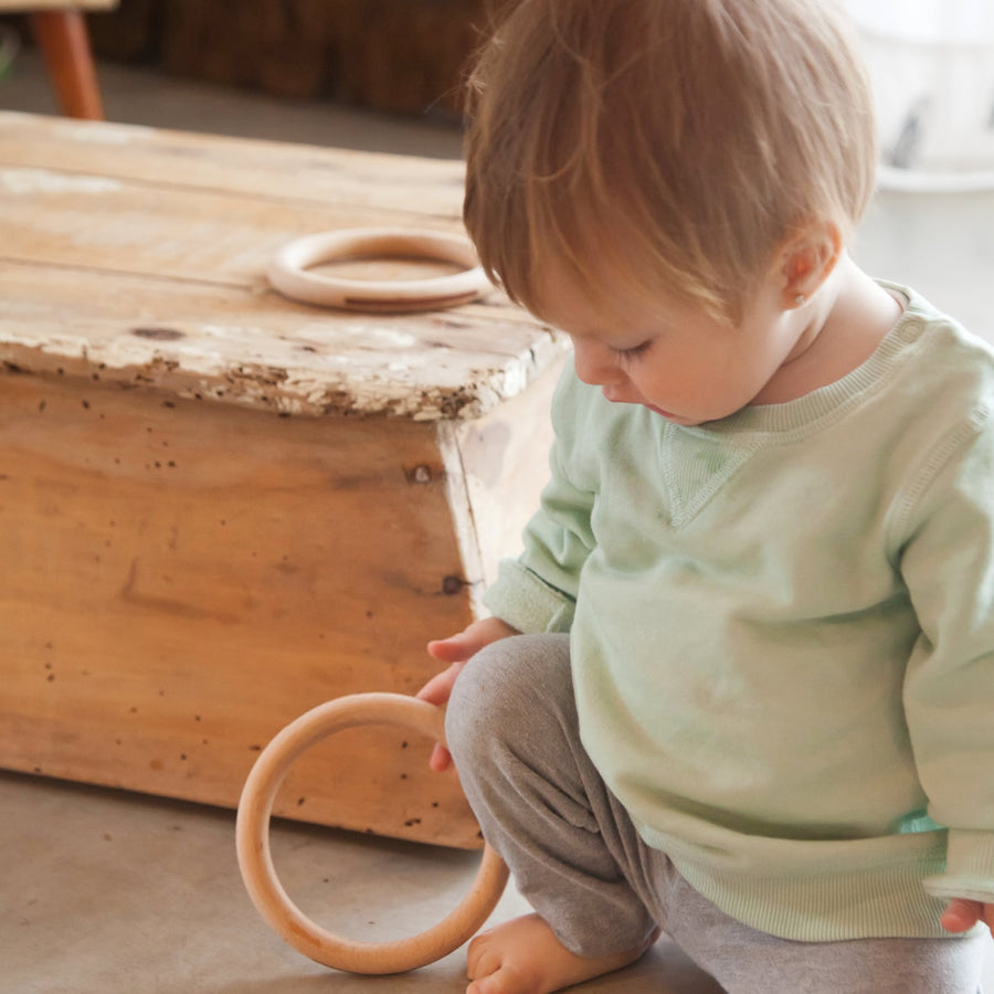 Baby playing with Grapat 3 Big Wooden Hoops