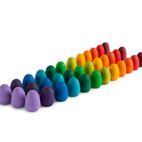 32 multicoloured Grapat Mandala Rainbow Eggs lined up in rows on a white background.