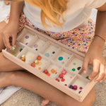 sorting the cubes into colours and putting them into bowls