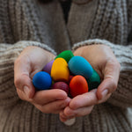 Grapat rainbow eggs held in hand.