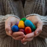 Grapat rainbow eggs held in hand.