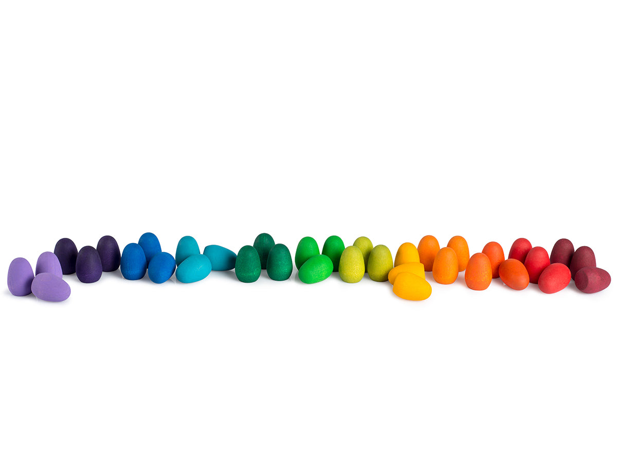 32 multicoloured Grapat Mandala Rainbow Eggs lined up on a white background.